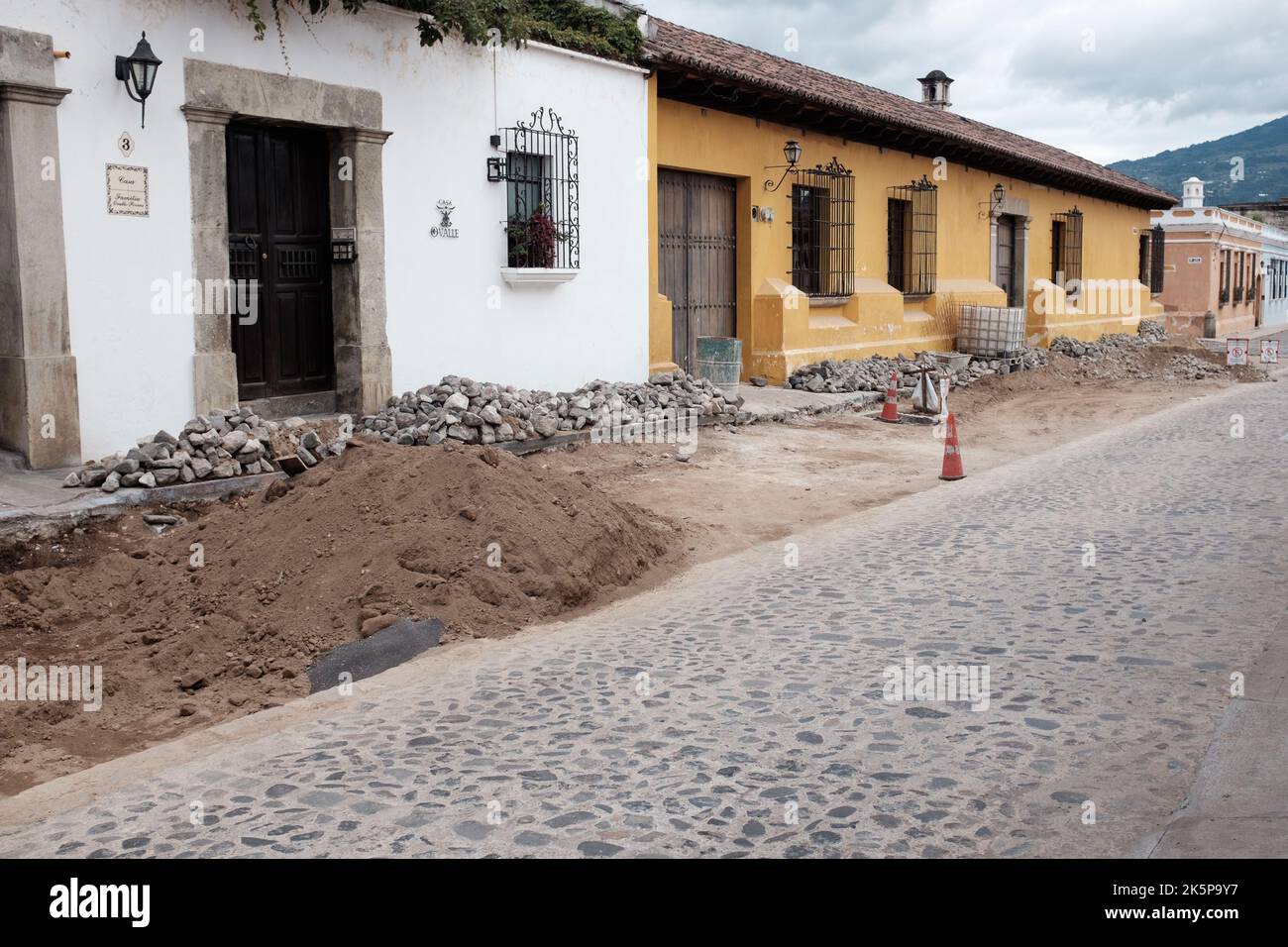 The famous cobblestone streets of Antigua Guatemala, Guatemala being renovated. Antigua's colonial architecture can be appreciated. Stock Photo