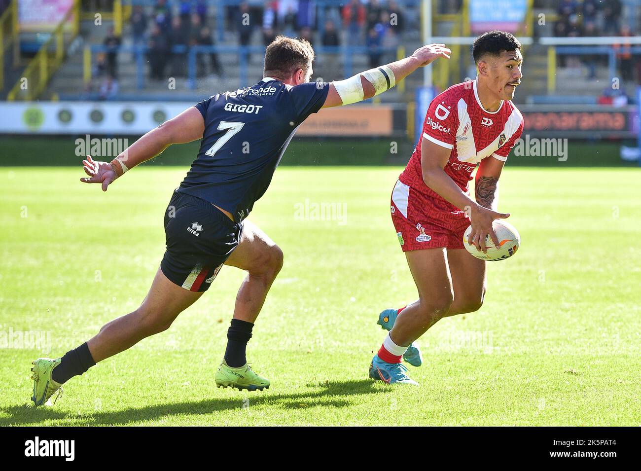 Halifax, England -8th October 2022 - Junior Amone of Tonga attempts to ...