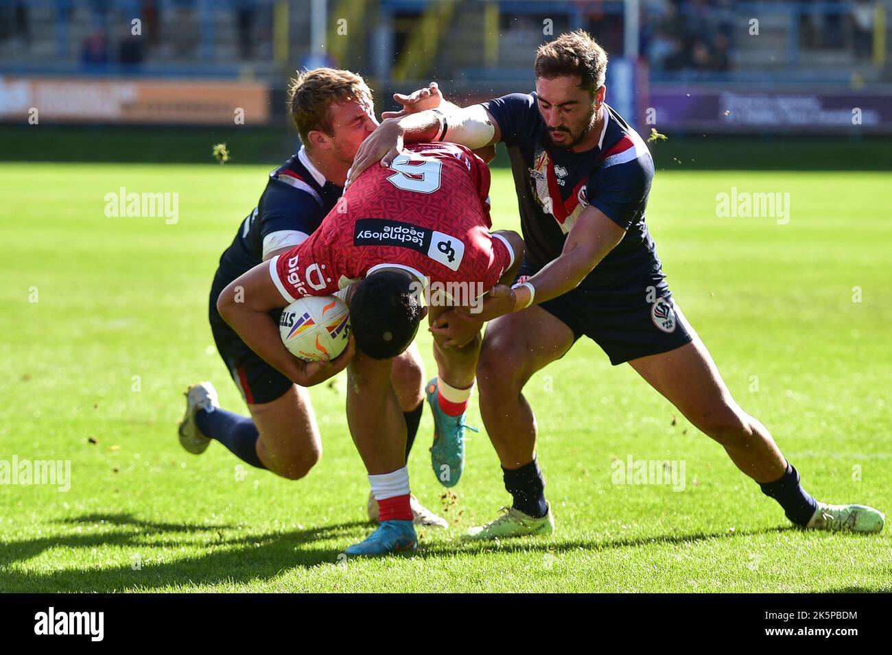 Halifax, England -8th October 2022 - Junior Amone of Tonga attempts to ...