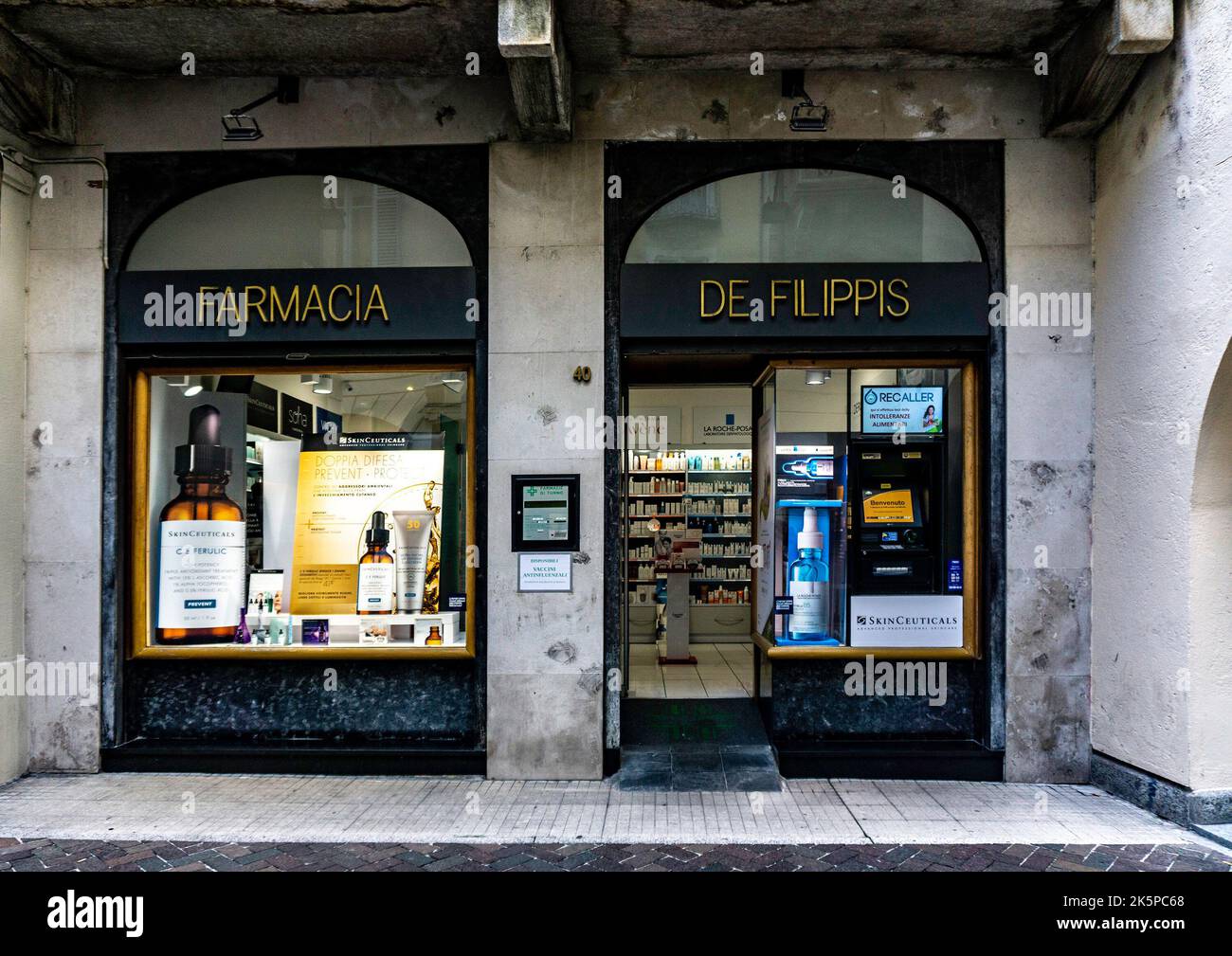 Farmacia De Filippis, a pharmacy store in Como, Italy. Stock Photo