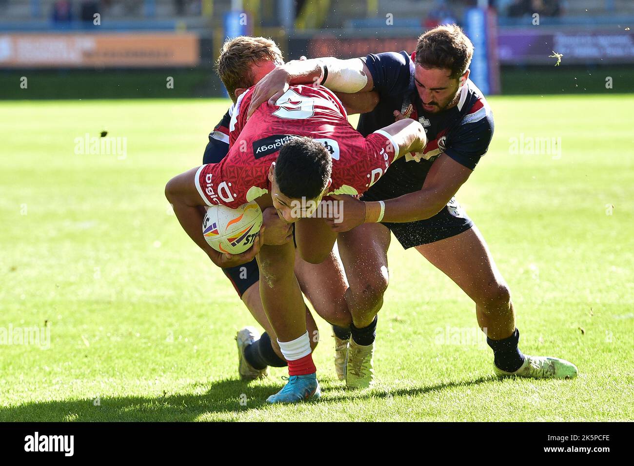 Halifax, England -8th October 2022 - Junior Amone of Tonga attempts to ...