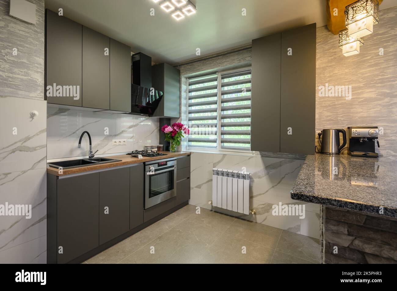 Interior of modern trendy grey kitchen Stock Photo - Alamy