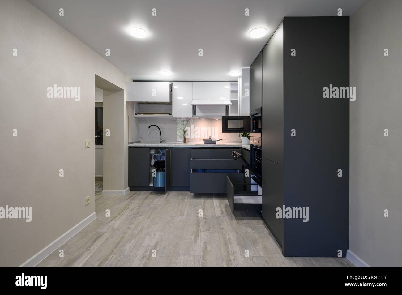 Modern simple trendy dark grey and white kitchen Stock Photo - Alamy