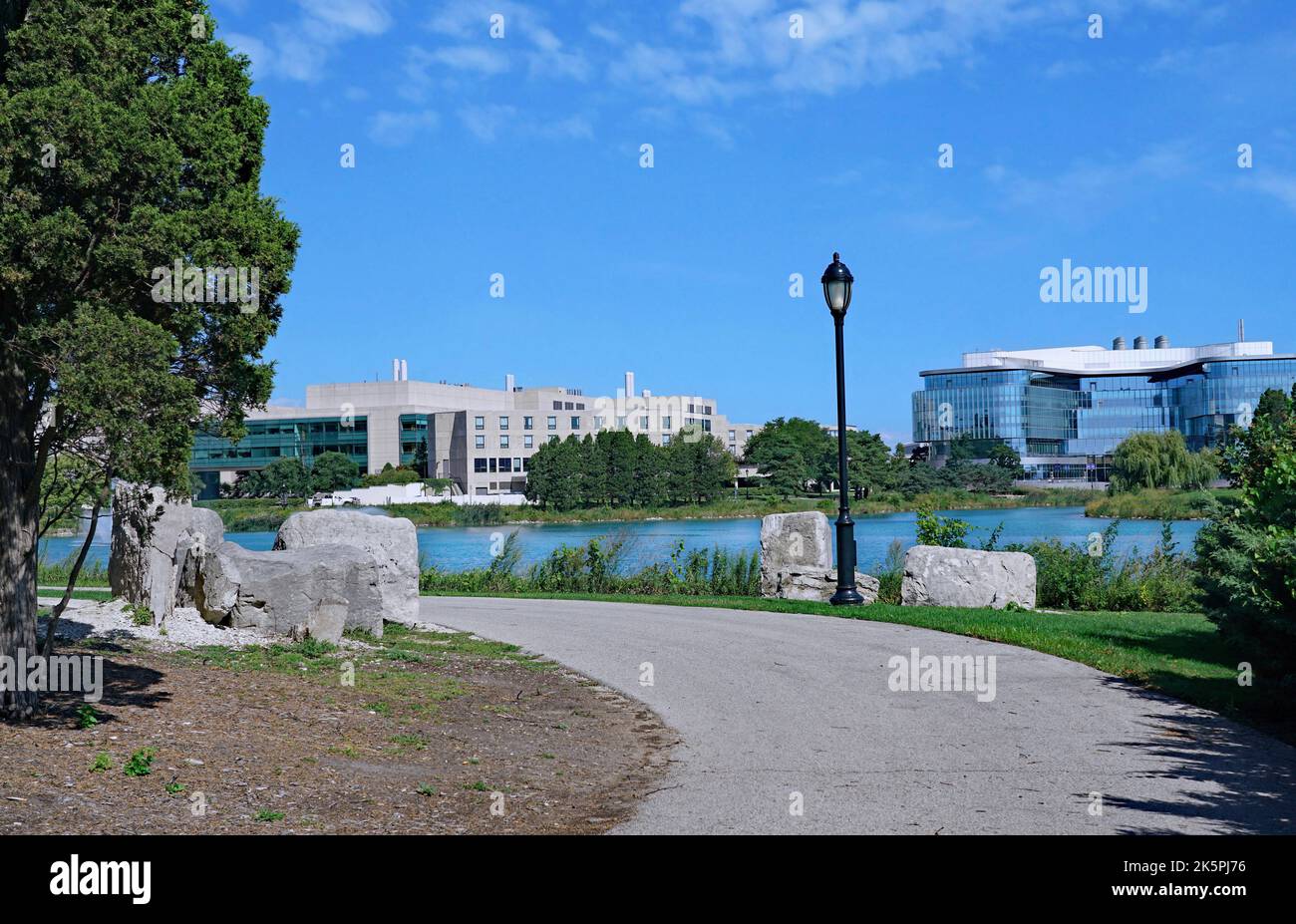 Evanston, IL - August 2022:  Lakefront path on the campus of Northwestern University, with the Kellogg School of Management building Stock Photo