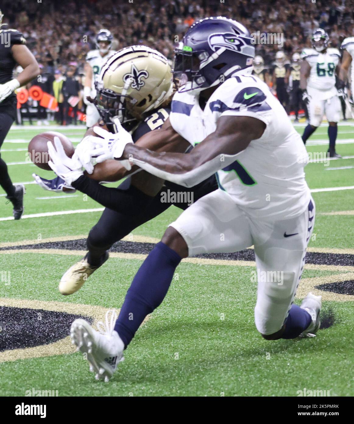 New Orleans, USA. 09th Oct, 2022. New Orleans Saints cornerback Bradley Roby (21) breaks up a two-point conversion pass that was intended for Seattle Seahawks wide receiver D.K. Metcalf (14) in the fourth quarter during a National Football League contest at the Caesars Superdome in New Orleans, Louisiana on Sunday, October 9, 2022. (Photo by Peter G. Forest/Sipa USA) Credit: Sipa USA/Alamy Live News Stock Photo