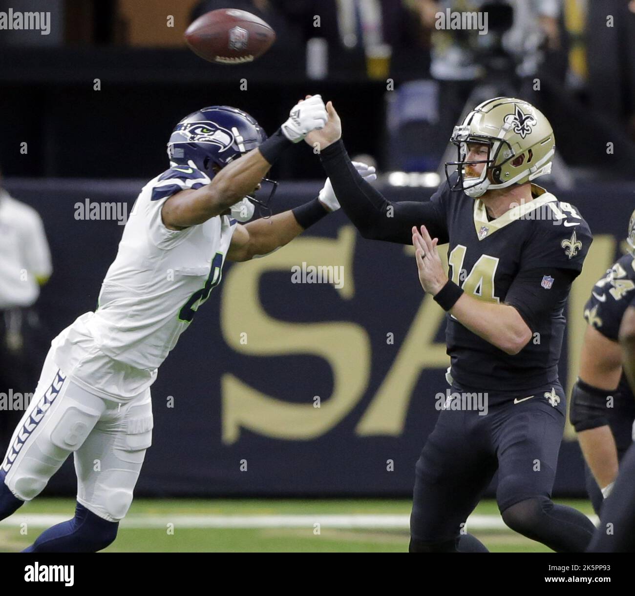 New Orleans, United States. 10th Oct, 2022. New Orleans Saints quarterback Andy Dalton (14) gets rid of the ball before Seattle Seahawks cornerback Coby Bryant (8) can get the sack at the Caesars Superdome in New Orleans on Sunday, October 9, 2022. Photo by AJ Sisco/UPI. Credit: UPI/Alamy Live News Stock Photo