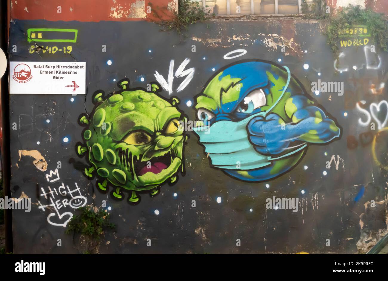 Coronavirus murals. Mural depicting creature in face mask battling corona-virus. Balat, Istanbul, Turkey. Covid-19 artwork. Stock Photo
