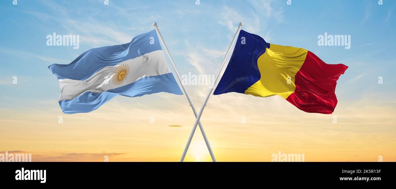 crossed national flags of Argentine and romania flag waving in wind at ...