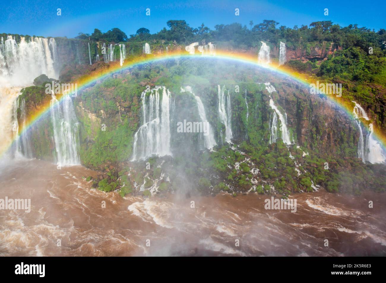 Iguazu Falls dramatic landscape with rainbow, view from Argentina side Stock Photo