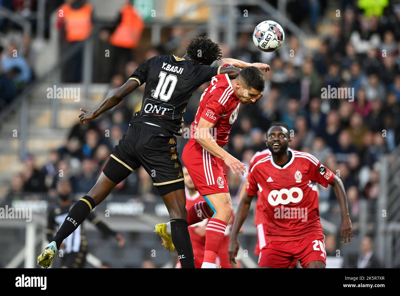 Charleroi's Youssouph Badji and Standard's Gojko Cimirot fight for the ball during a soccer match between Sporting Charleroi and Standard Liege, Sunday 09 October 2022 in Charleroi, on day 11 of the 2022-2023 'Jupiler Pro League' first division of the Belgian championship. BELGA PHOTO JOHN THYS Stock Photo