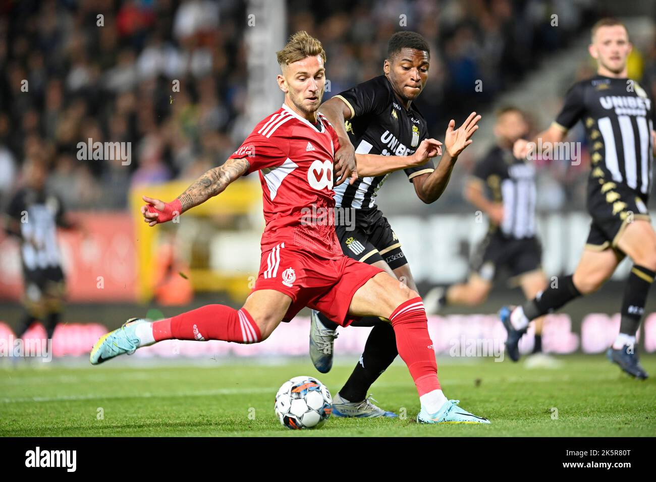 Standard's Denis Dragus and Charleroi's Loic Bessile fight for the ball during a soccer match between Sporting Charleroi and Standard Liege, Sunday 09 October 2022 in Charleroi, on day 11 of the 2022-2023 'Jupiler Pro League' first division of the Belgian championship. BELGA PHOTO JOHN THYS Stock Photo