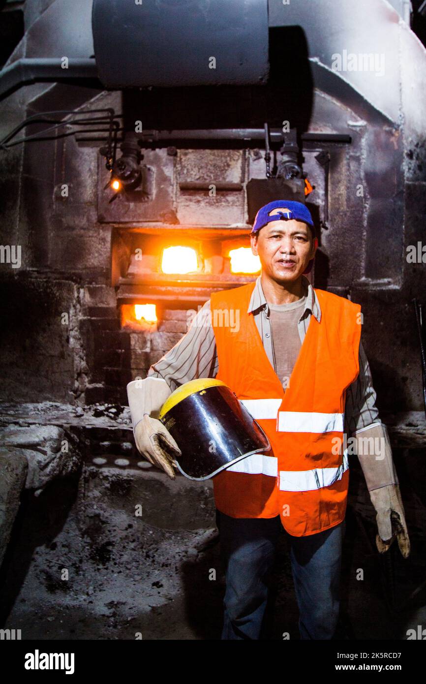 Furnace worker at a gold mining processing plant in Benguet