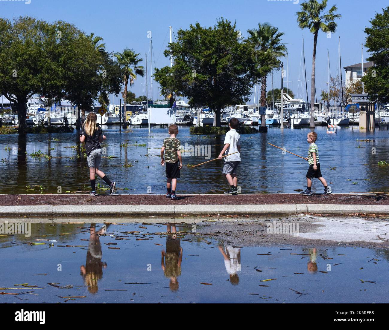 Sanford, United States. 09th Oct, 2022. Children play in a flooded