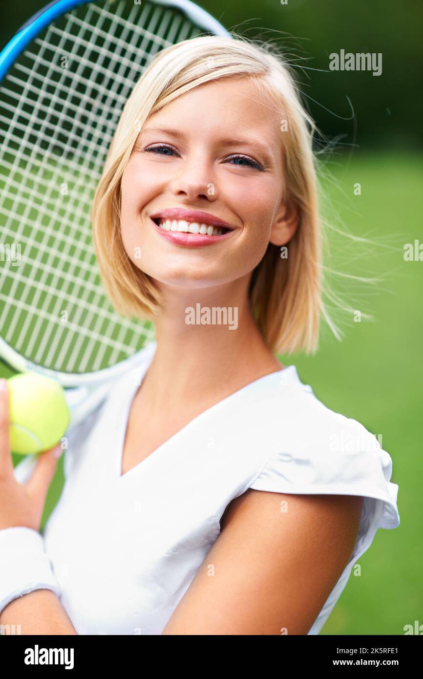 For the love of the game. Portrait of a young female tennis player