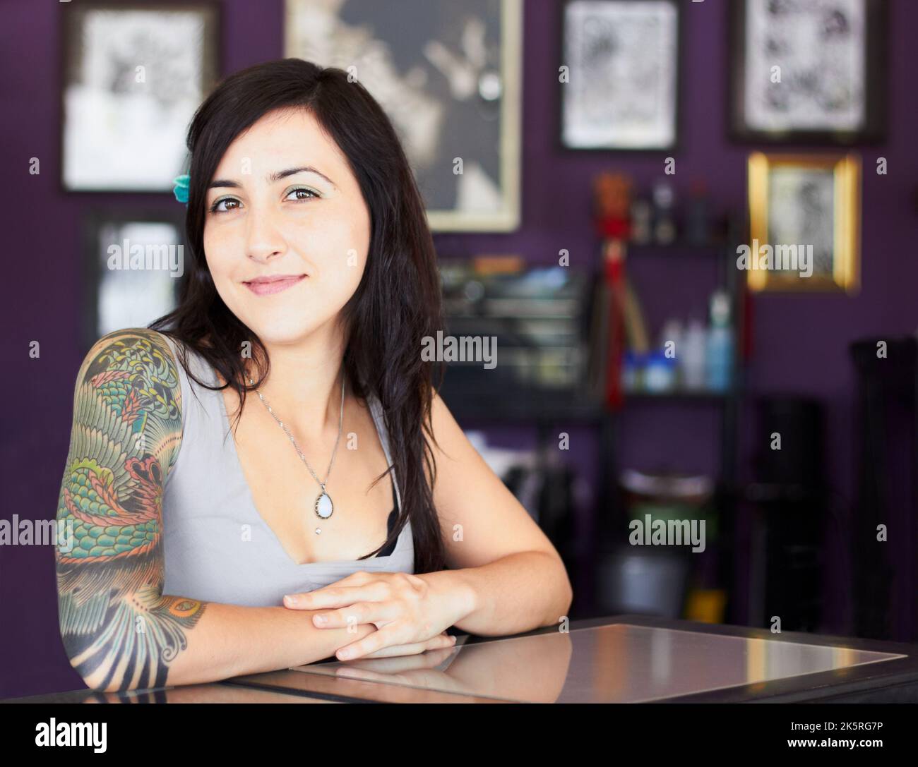Free to express her individuality. Portrait of an attractive young tattoo artist in her tattoo parlor. Stock Photo