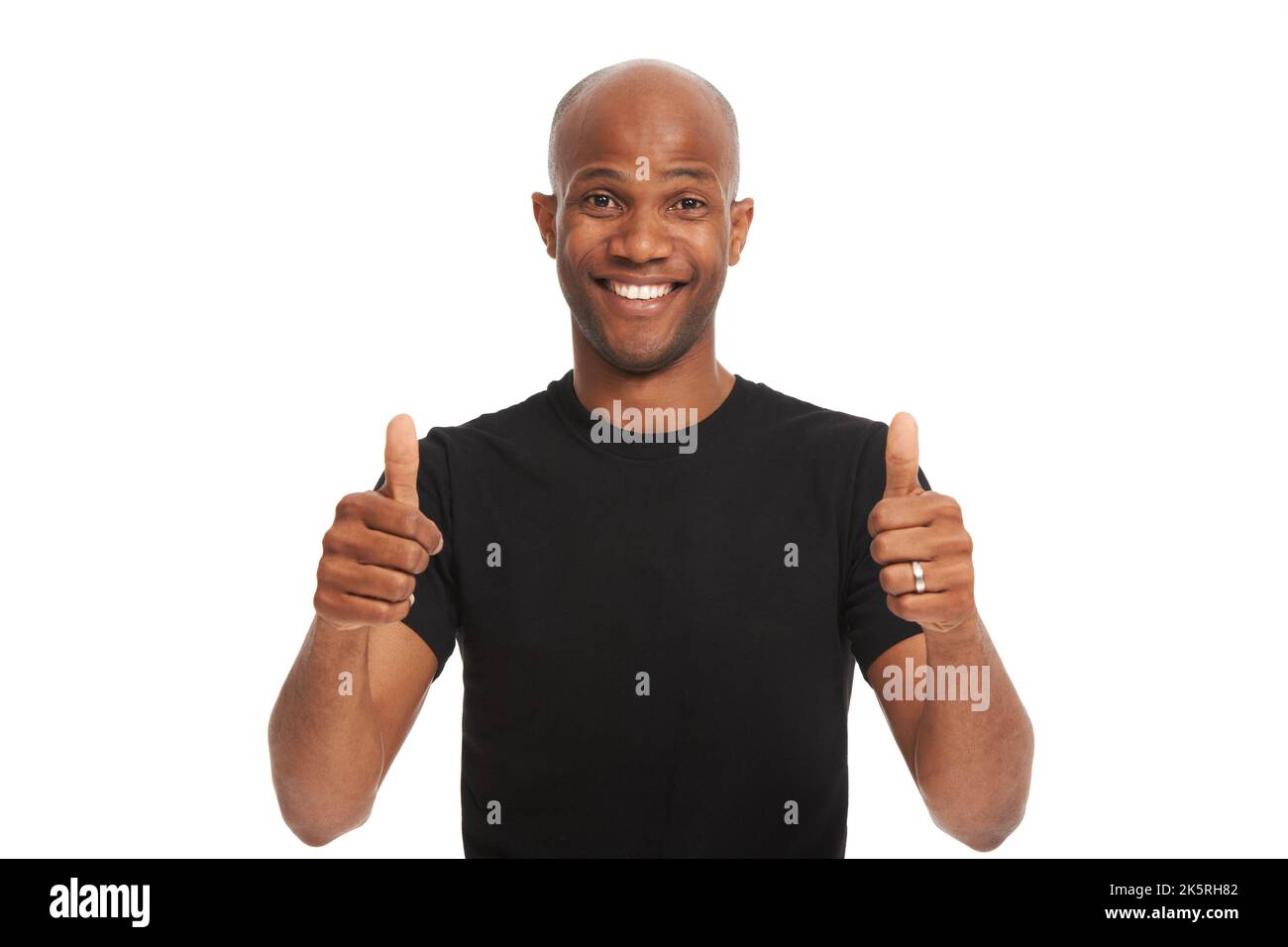 Youre doing great. Studio portrait of a handsome african american man giving the thumbs up isolated on white. Stock Photo