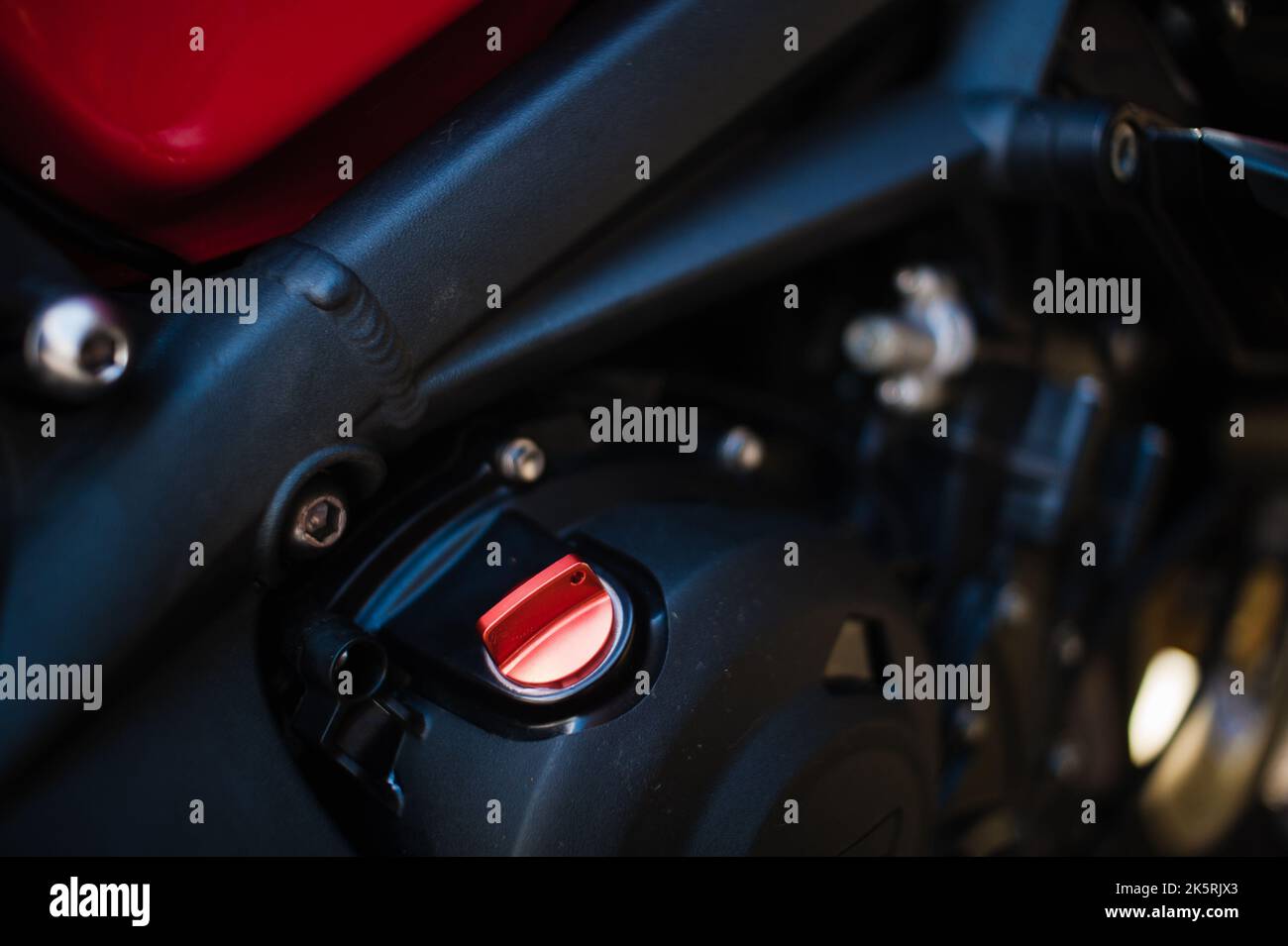 A closeup of triumph street triple clutch cover, engine cover of a