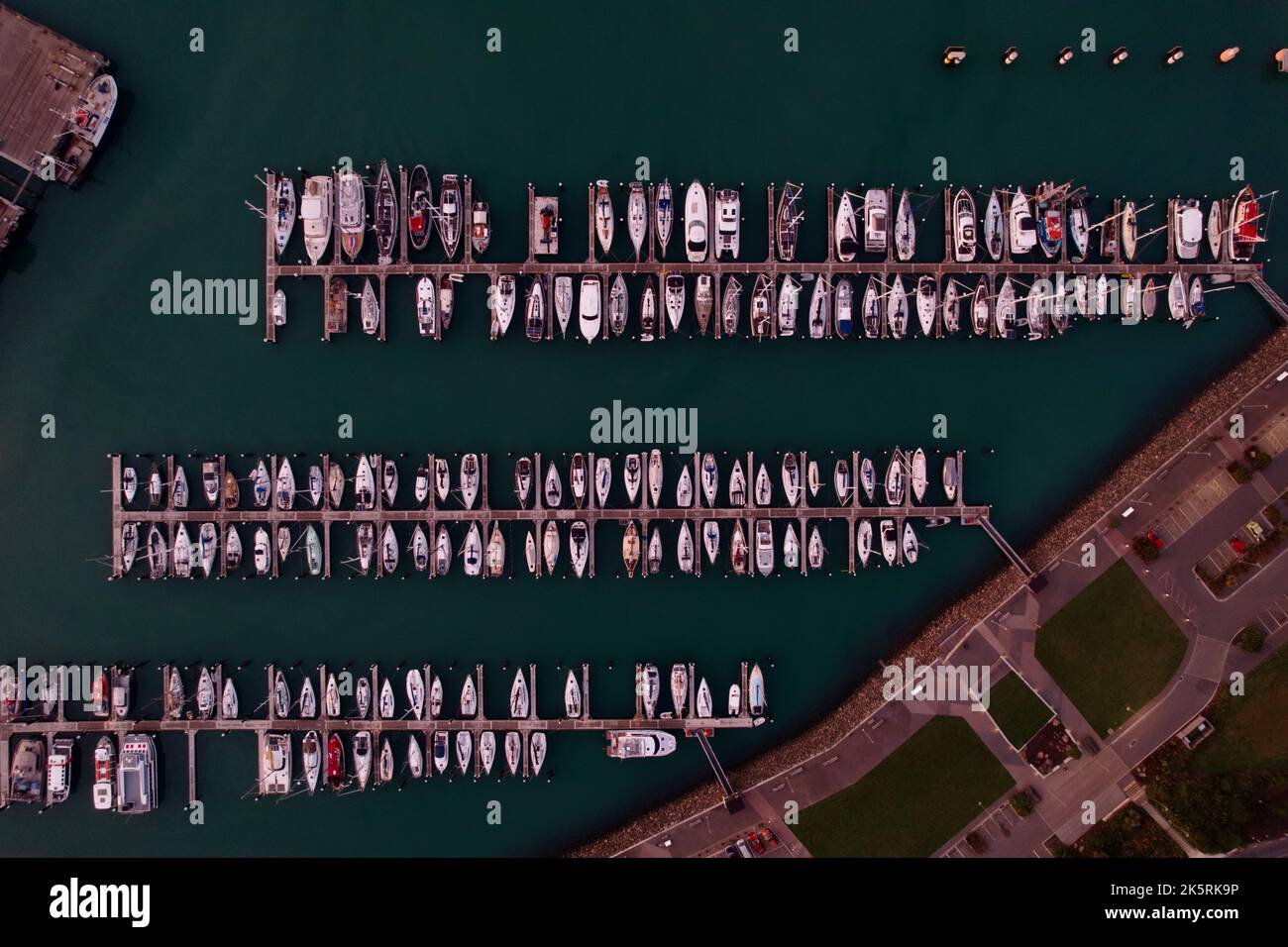 An aerial top view of boats moored at a harbor docks in Lyttelton ...