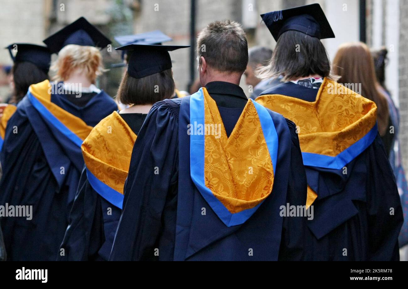 File photo dated 12/10/11 of university graduates at Anglia Ruskin University in Cambridge. Almost 300,000 students will be gravely impacted by the cost-of-living crisis if financial support is not introduced, new analysis by MillionPlus has warned. The report by the association for modern universities in the UK, said a student recruitment and retention crisis could be created if the challenges facing students are not addressed. Issue date: Monday October 10, 2022. Stock Photo