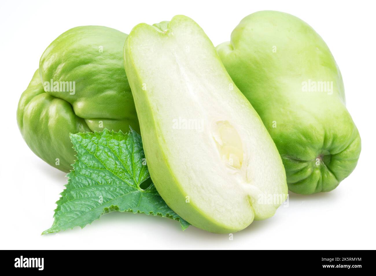 Chayote fruits and half of chayote fruit isolated on white background. Stock Photo