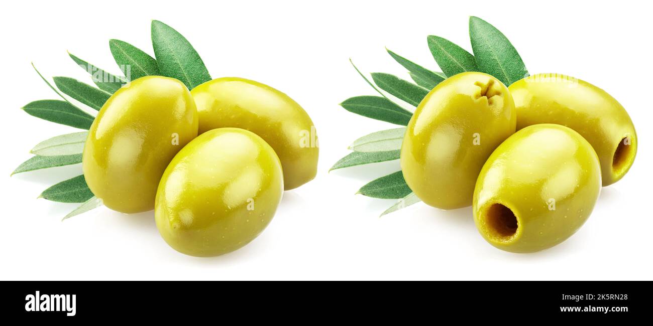 Green pitted olives and whole green olives with leaves isolated on