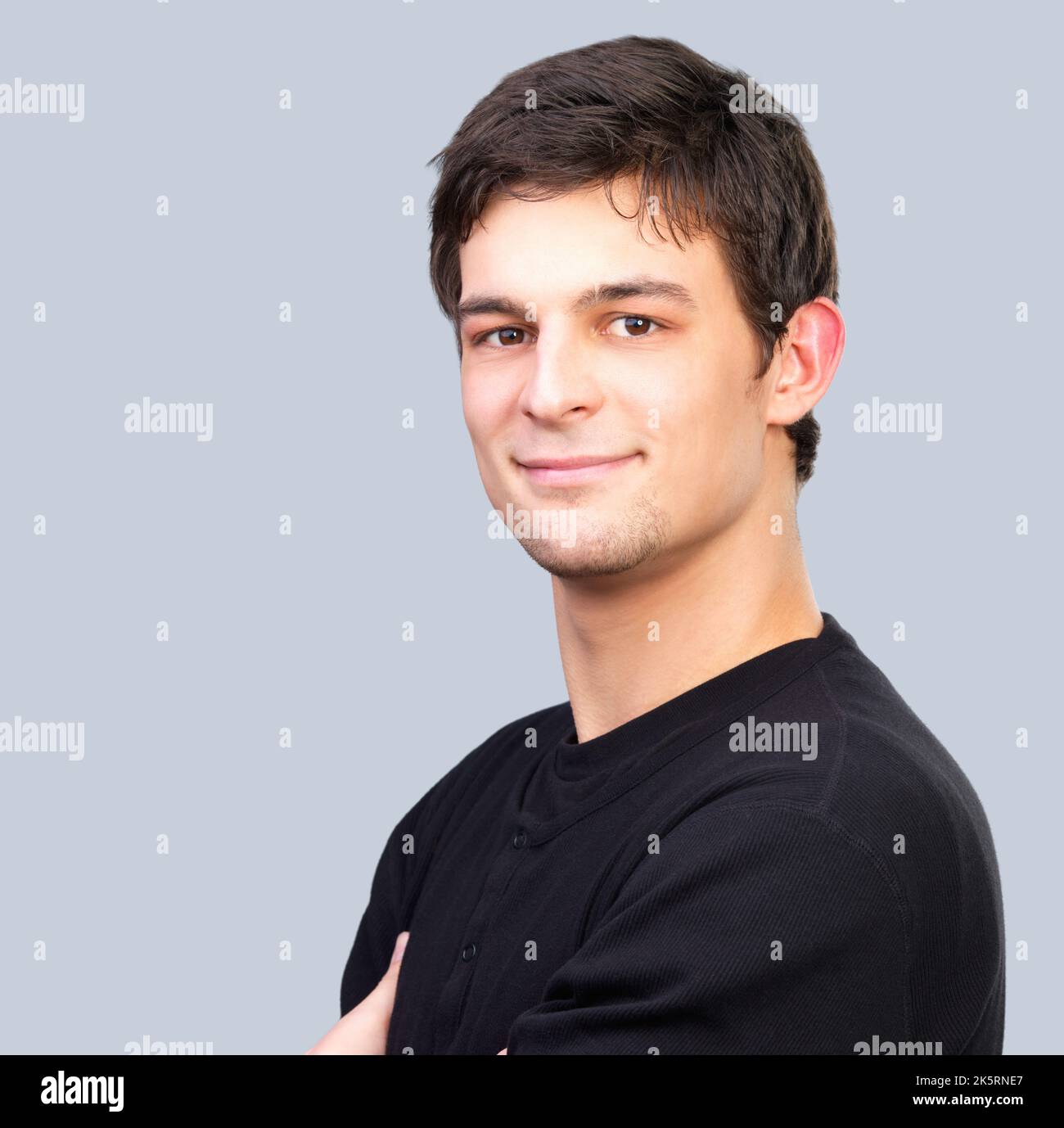 Confident in his style. A young man in casual wear smiling at the camera. Stock Photo