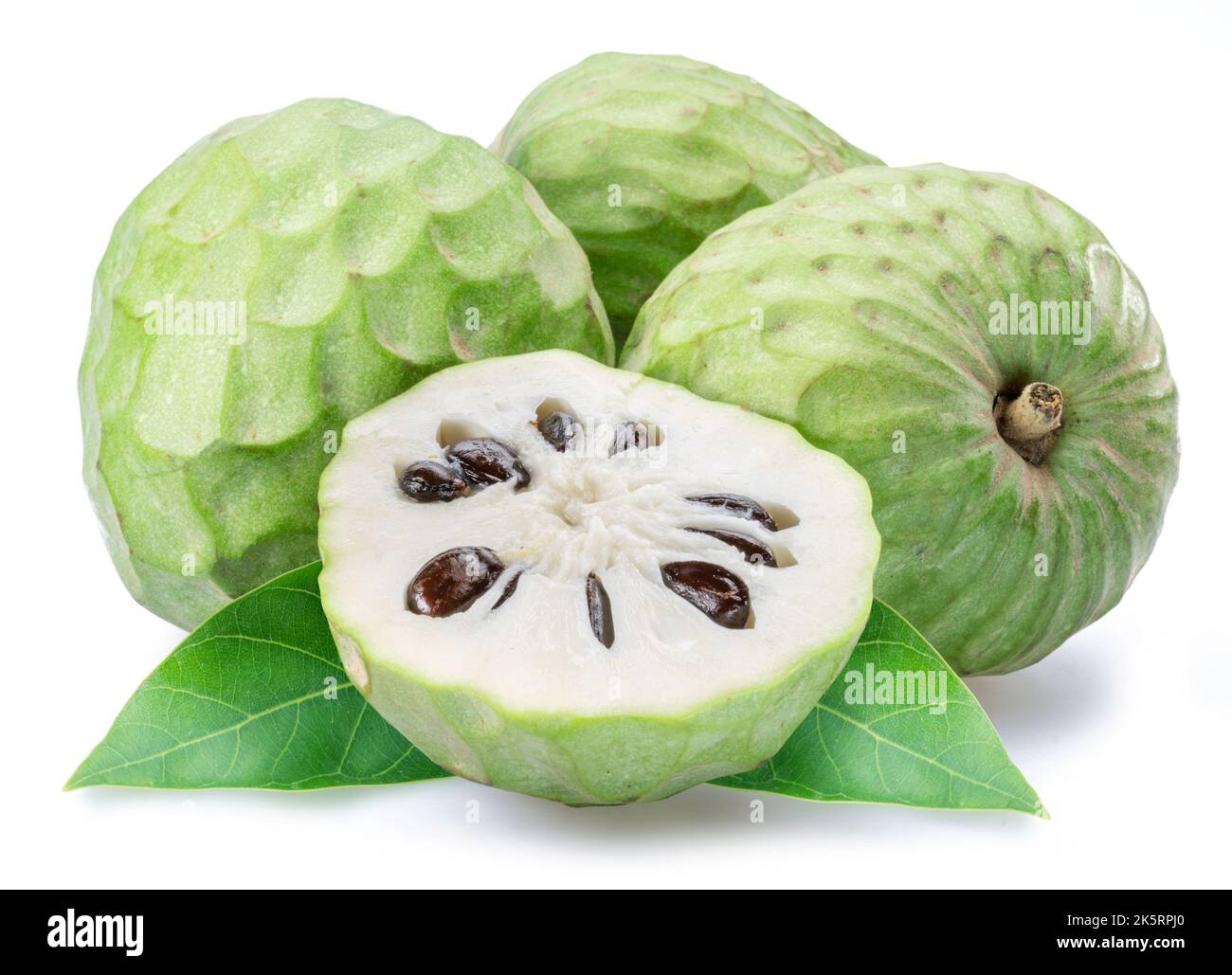 Custard apples or cherimoya fruits and slice of fruit isolated on white