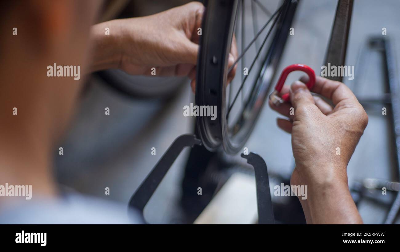 Repairing bicycle wheel in Wheel Truing Stands Stock Photo