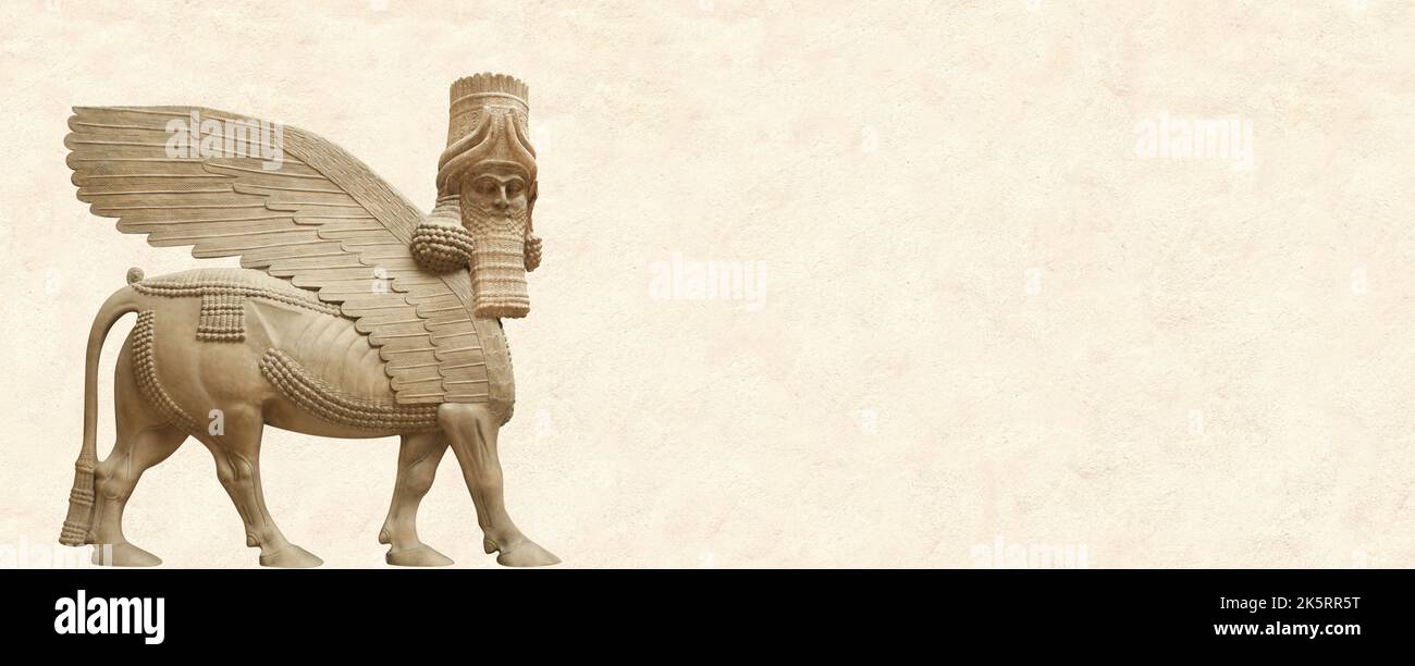 Grunge background with stone texture and lamassu - human-headed winged bull. Horizontal banner with assyrian protective deity. Copy space for text. Mo Stock Photo