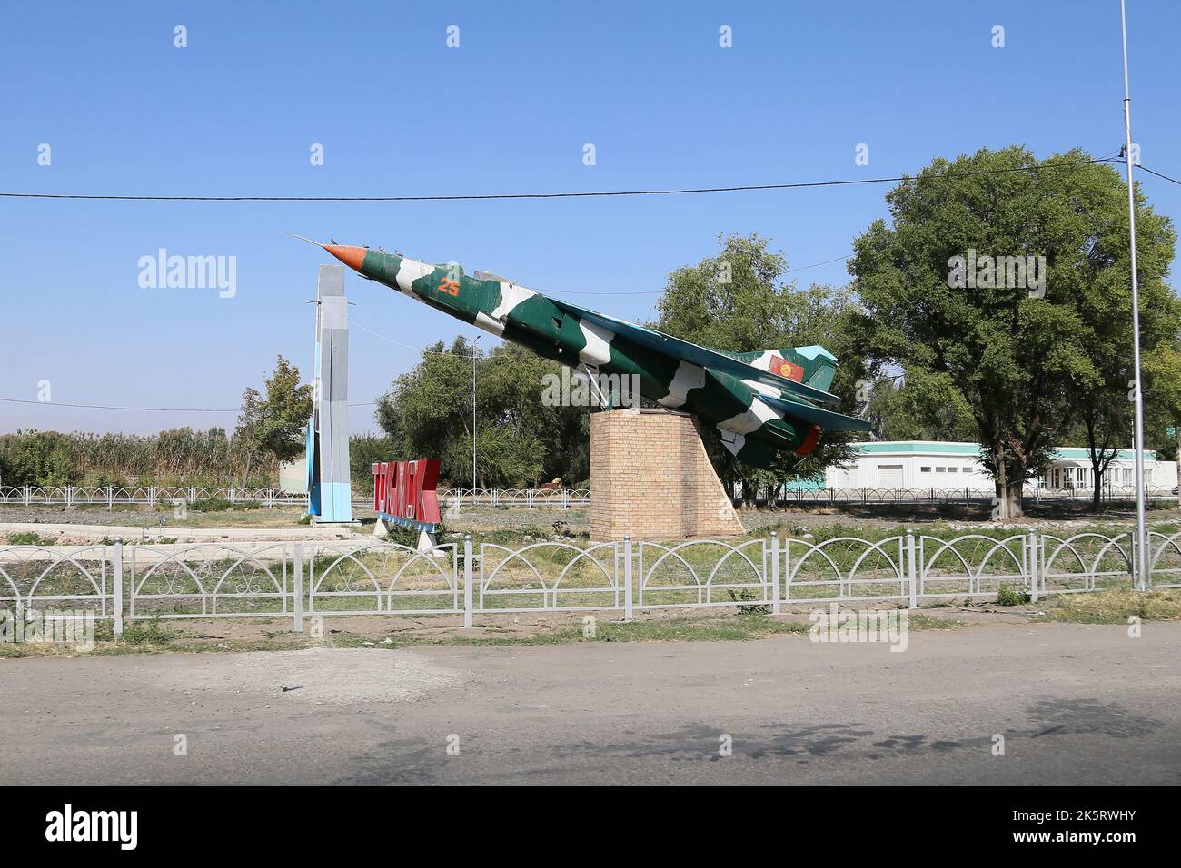 Mikoyan-Gurevich MiG-23MS fighter at road intersection, Tokmok, Chui Valley, Chui Region, Kyrgyzstan, Central Asia Stock Photo