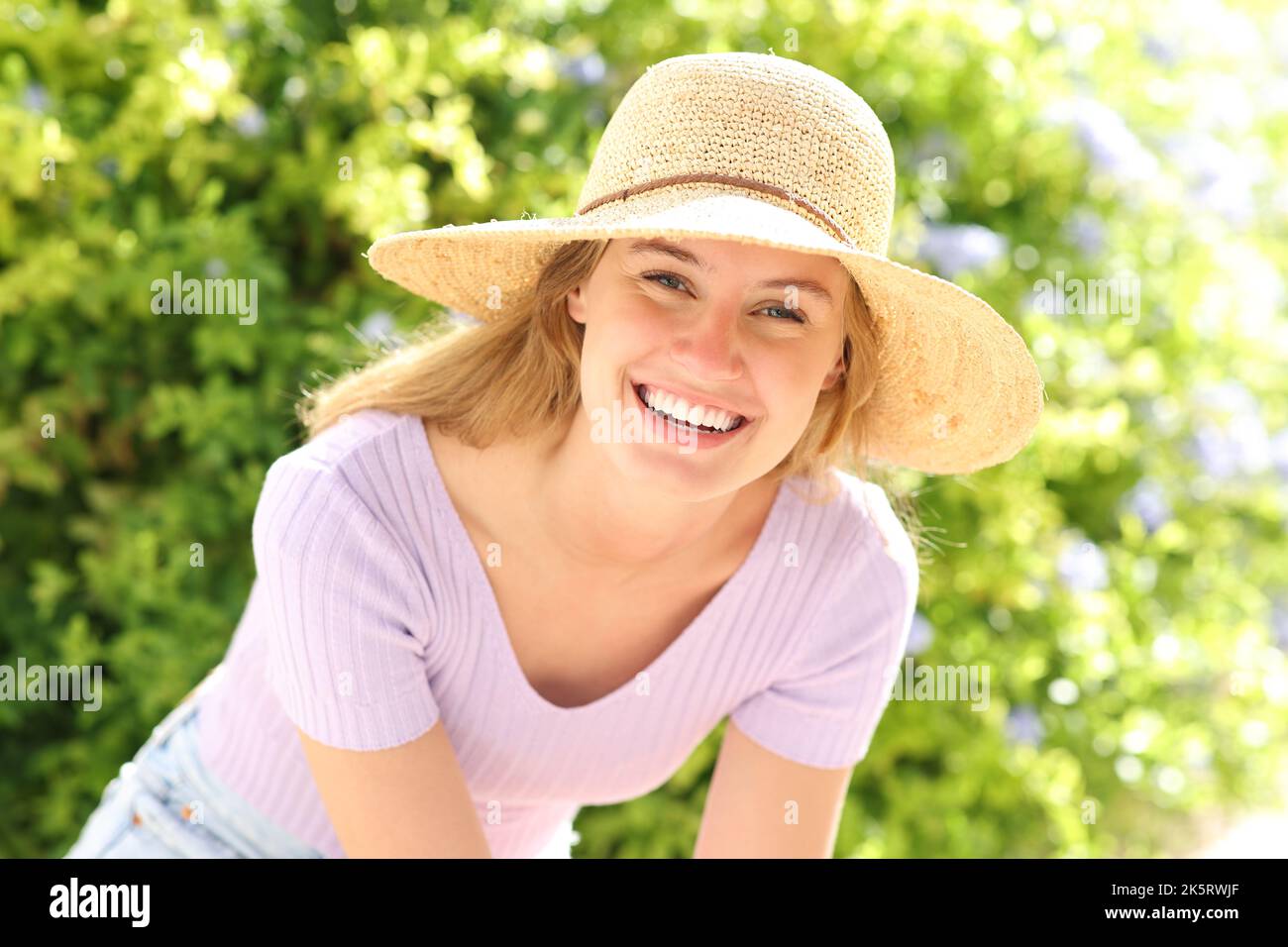 Portrait of a happy teen looking at camera in a park Stock Photo