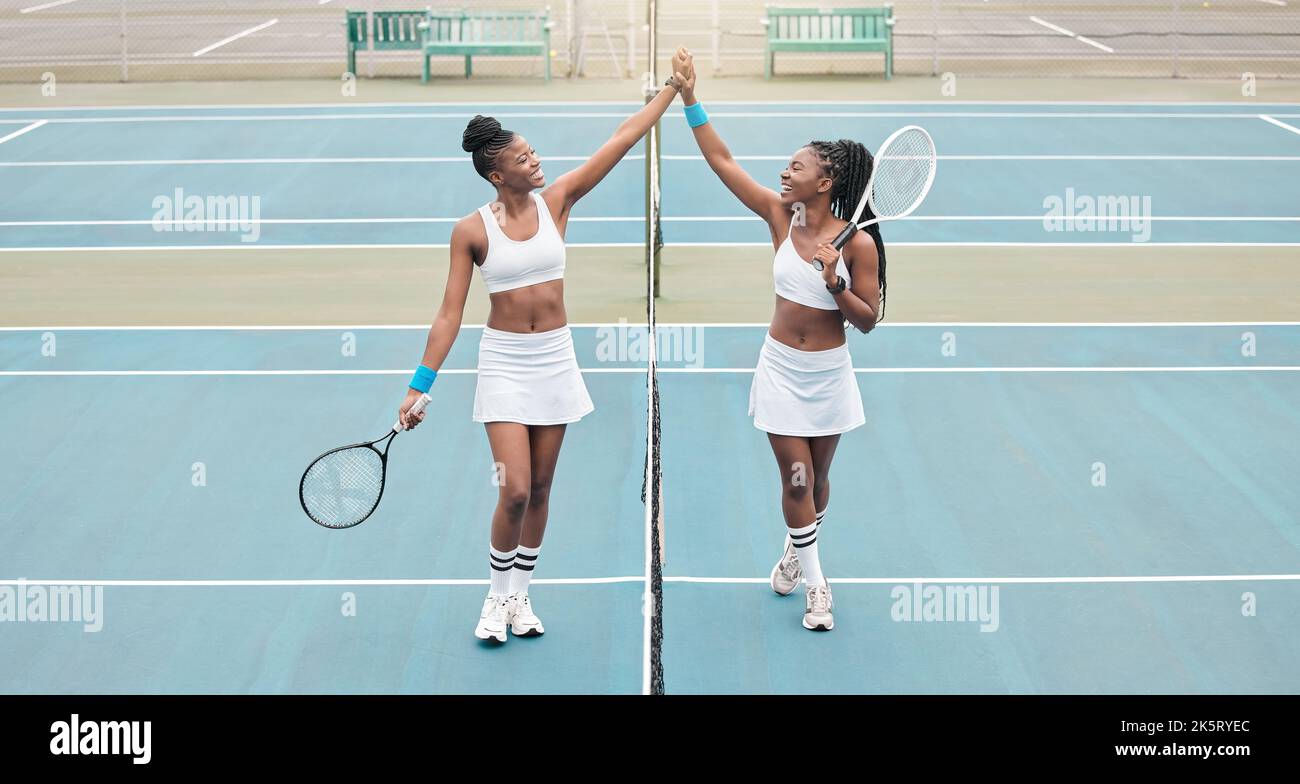 Young girls celebrate after a tennis match. Professional athletes
