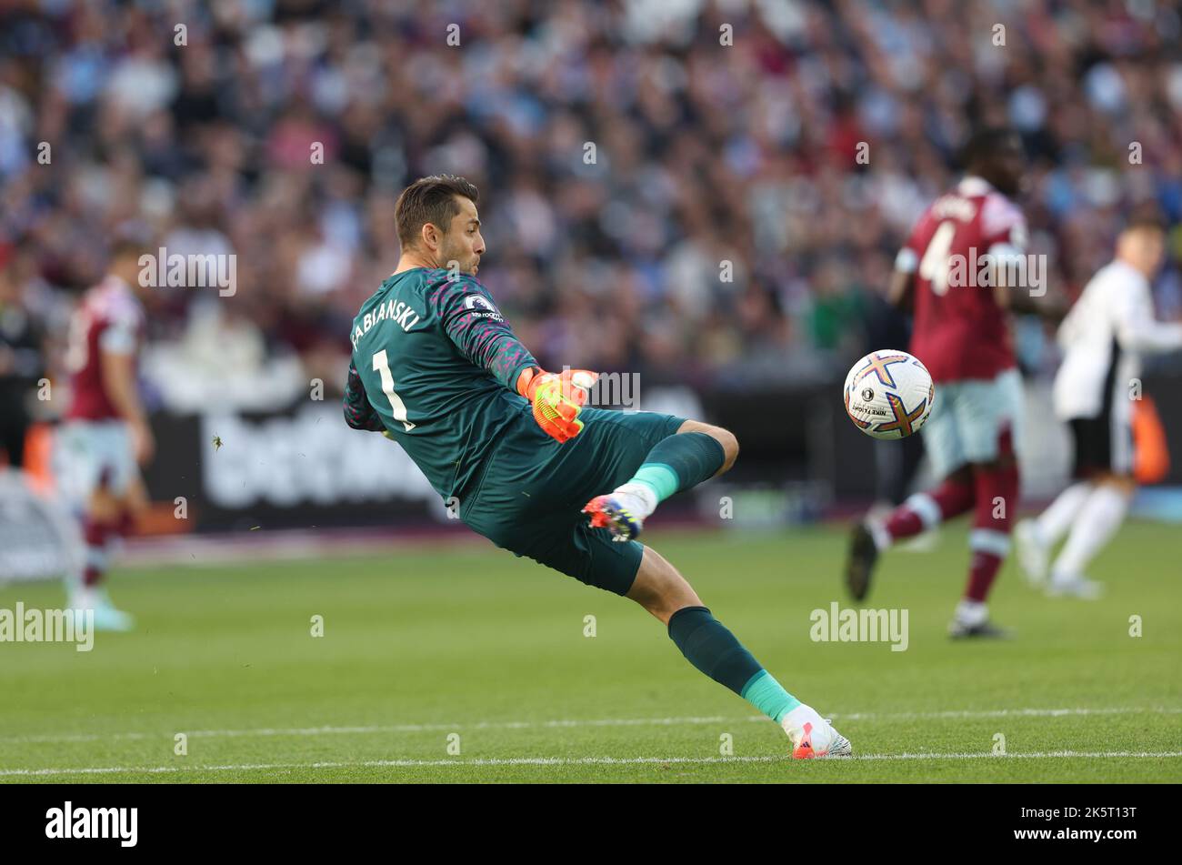 West Ham's Lukasz Fabianski kicks the ball out during the Premier league match between West Ham United and Fulham at the London Stadium. 9th Oct 2022 Stock Photo