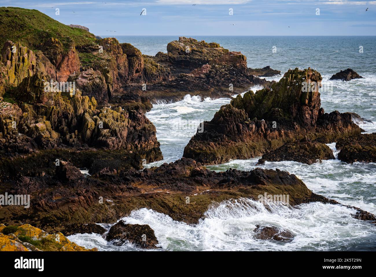 A beautiful shot of waves crashing against the rocky coastline Stock ...