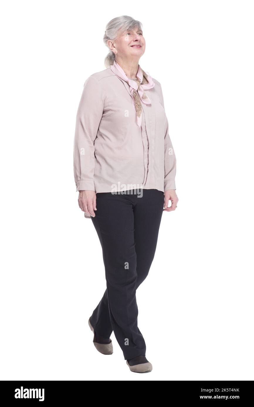 confident old lady striding forward. isolated on a white background ...