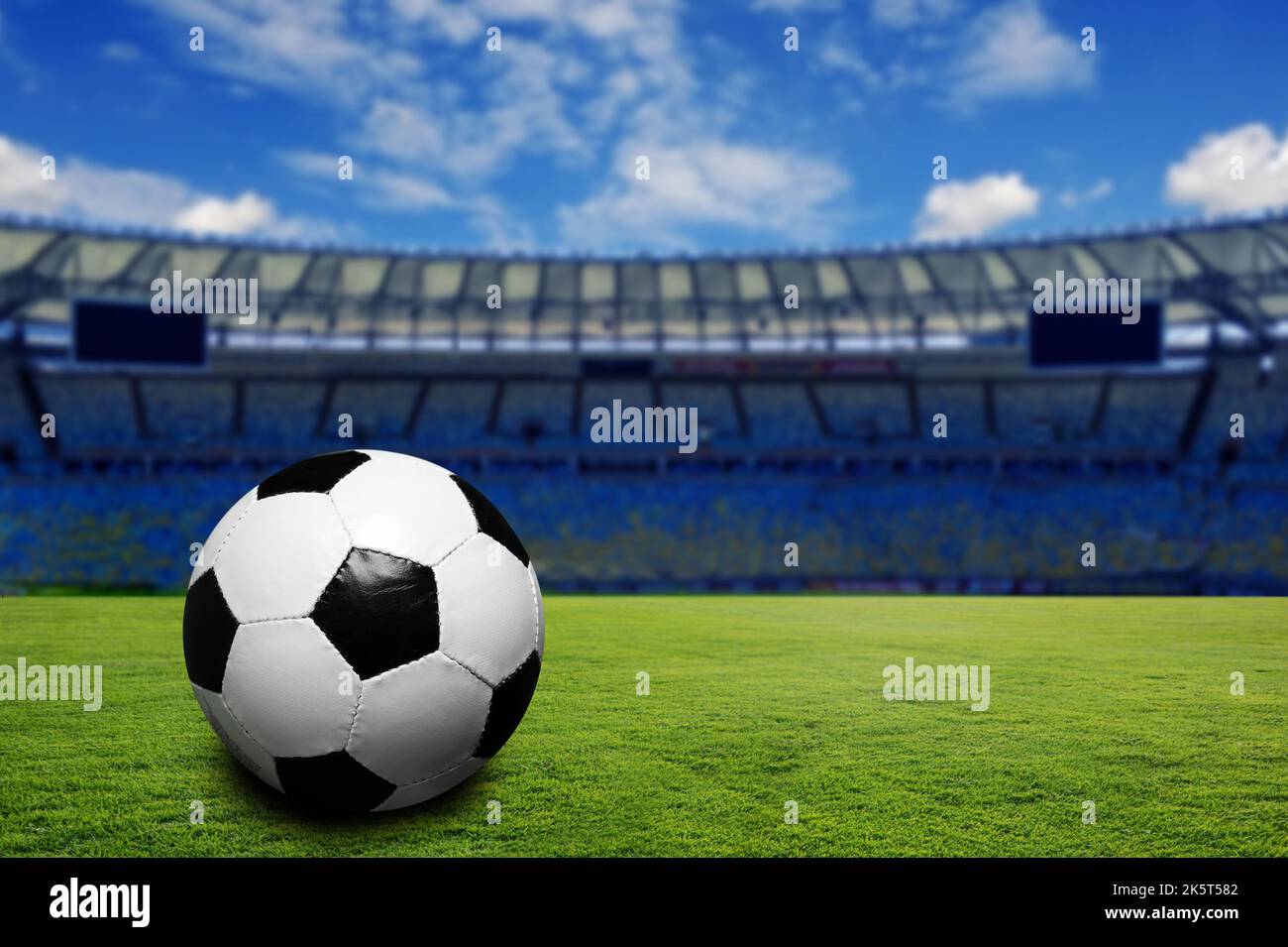 soccer ball on a pitch inside a stadium Stock Photo Alamy