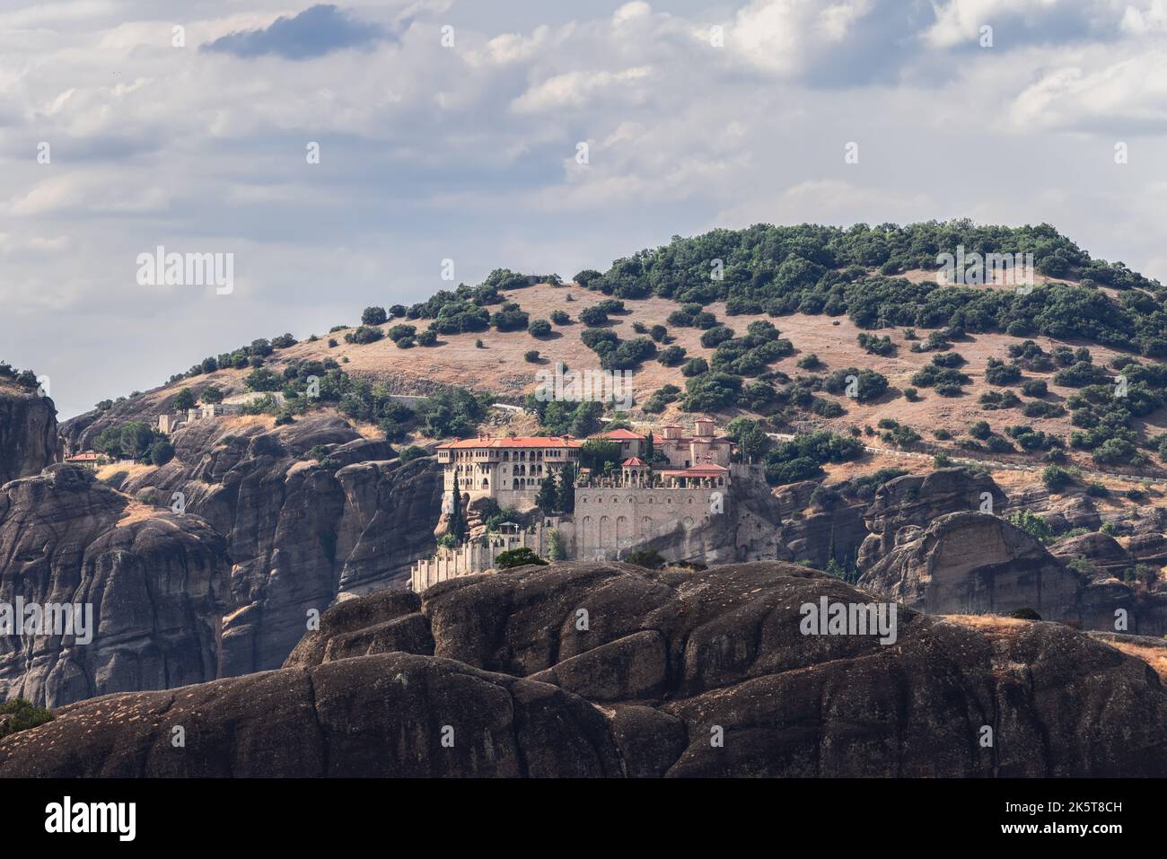 Medieval Varlaam monastery is perched on a steep and magnificent pillar-like rock which rises above the town of Kalambaka, second big in size in Meteo Stock Photo