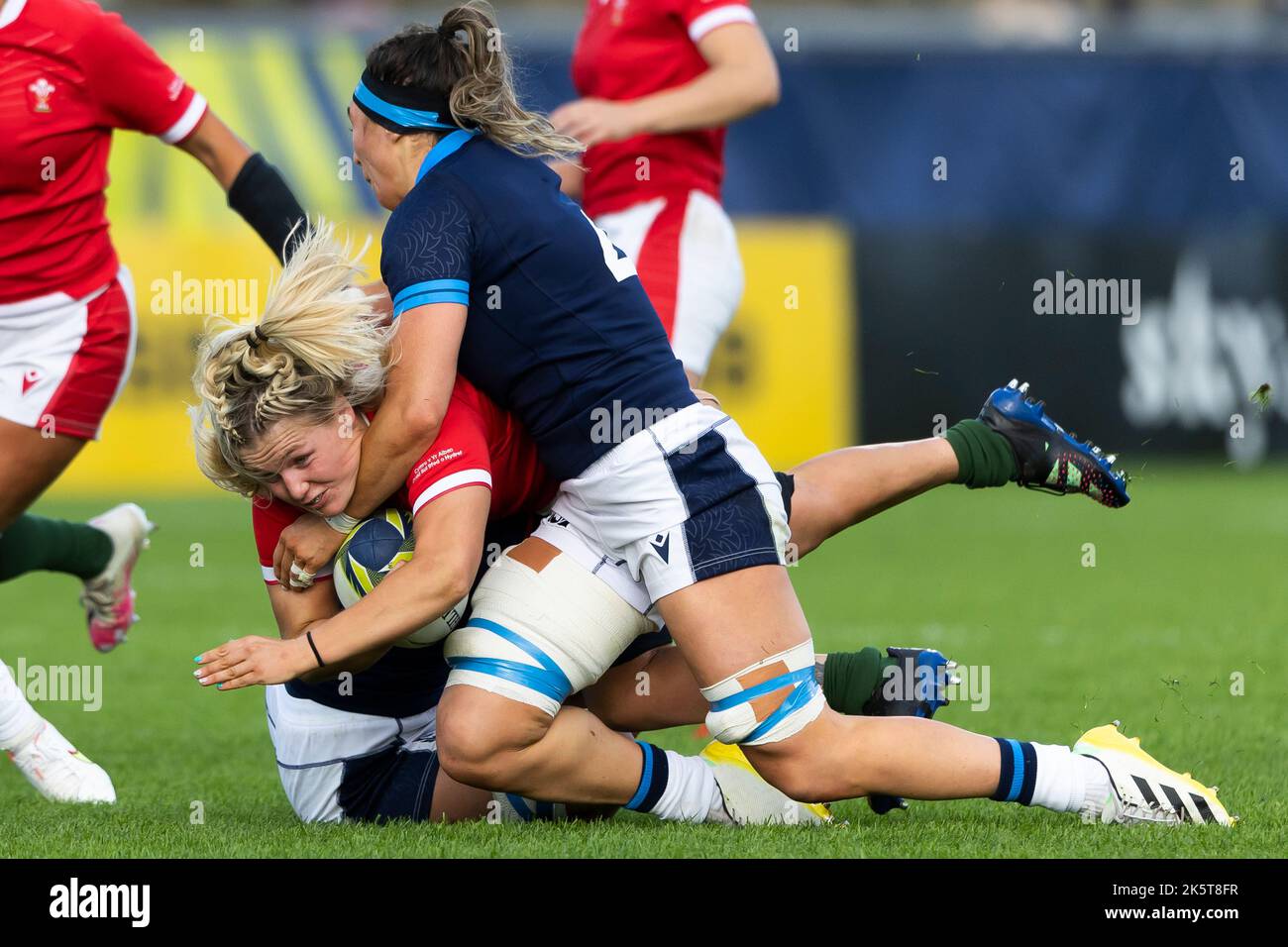 Wales' Alex Callender is tackled by Scotland's Emma Wassell during the Women's Rugby World Cup group stage match at the Semenoff Stadium, Whangarei. Picture date: Sunday October 9, 2022. Stock Photo
