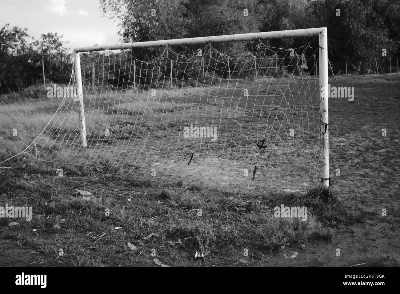 Soccer Goal, Monochrome photo of a soccer goal on a dirt field in the Cikancung area, Indonesia Stock Photo