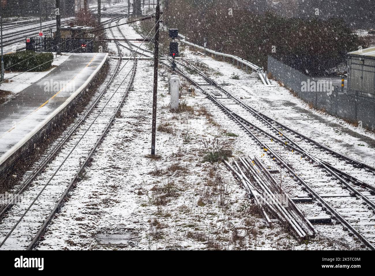 Railway tracks covered in winter snow at Welwyn Garden City railway station, UK Stock Photo