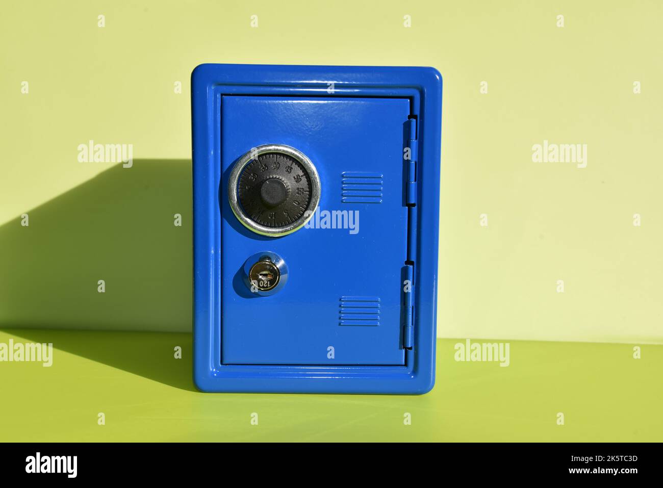 a small blue toy safe Stock Photo