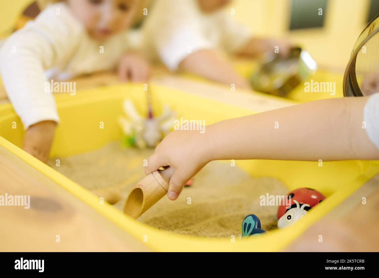 Children are playing with sand in developmet centre. Kindergarten Stock ...