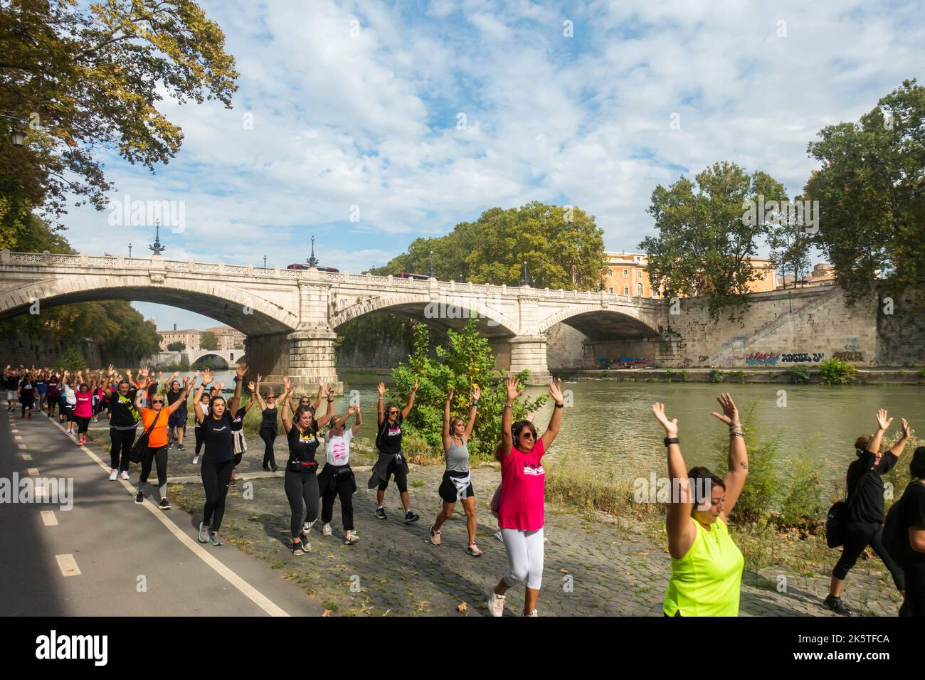 Rome, Italy - October 2022 - People doing physical activity along the Tiber River Stock Photo