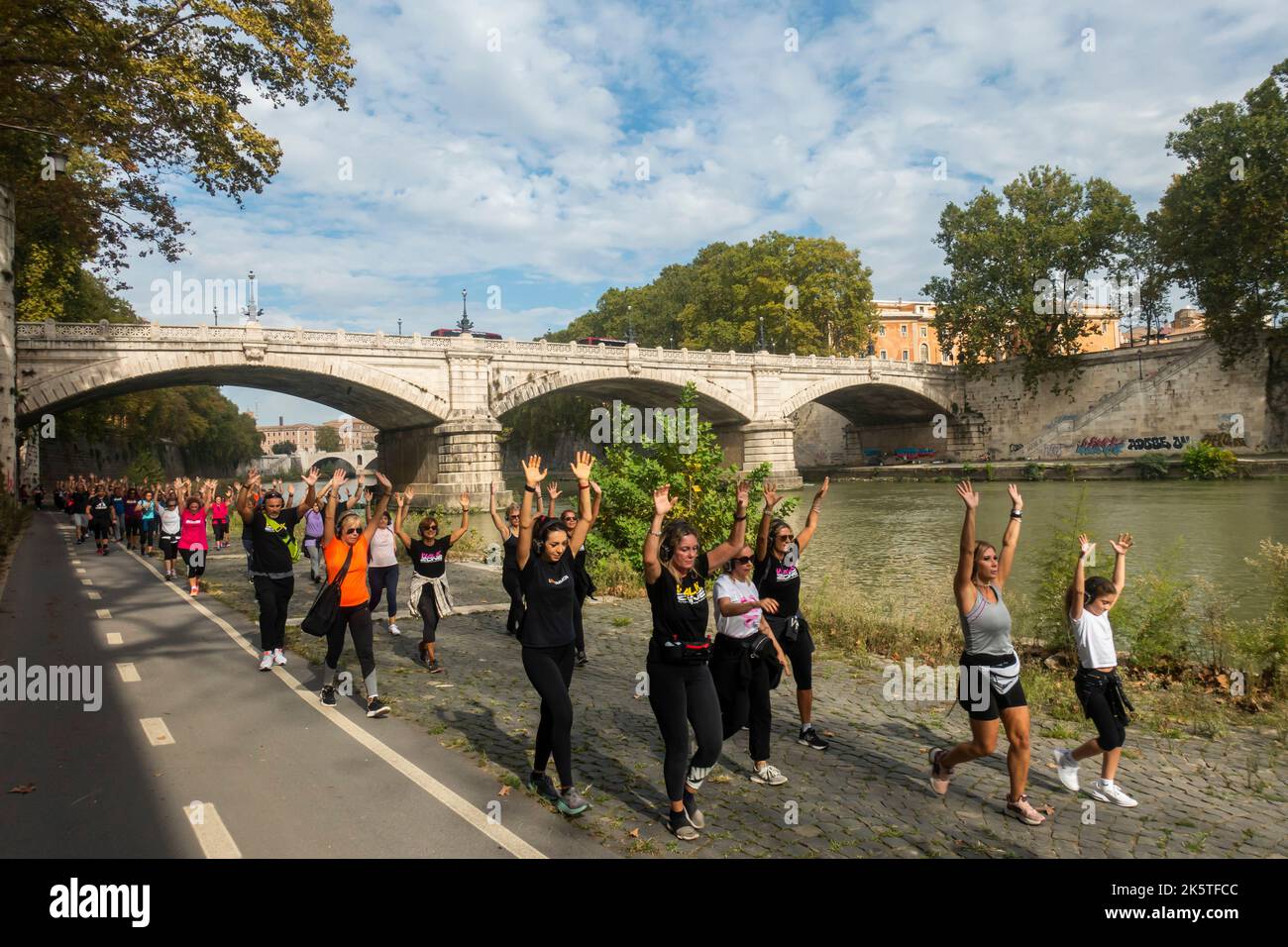 Rome, Italy - October 2022 - People doing physical activity along the Tiber River Stock Photo