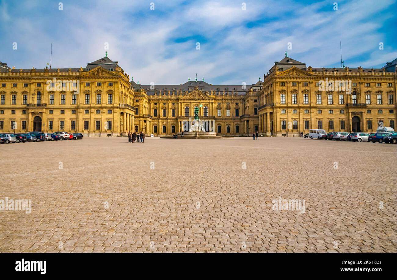 Lovely panoramic view of the town side facade of the famous Würzburg Residence in Baroque style in Germany. The square in front of the palace, also... Stock Photo