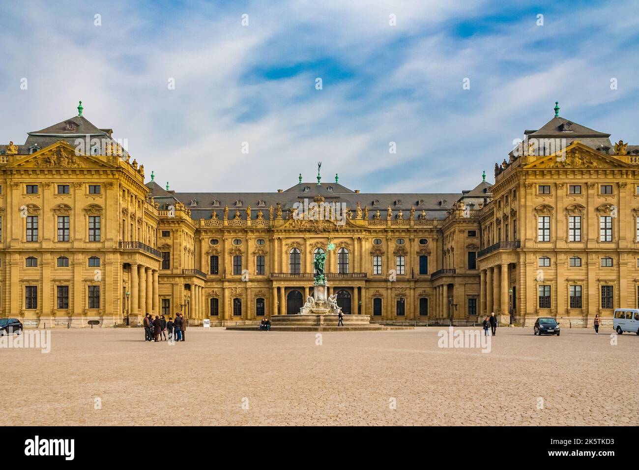 Picturesque view of the front facade of the famous Würzburg Residence in Baroque style in Germany. The side wings partially enclose the Cour d'honneur... Stock Photo