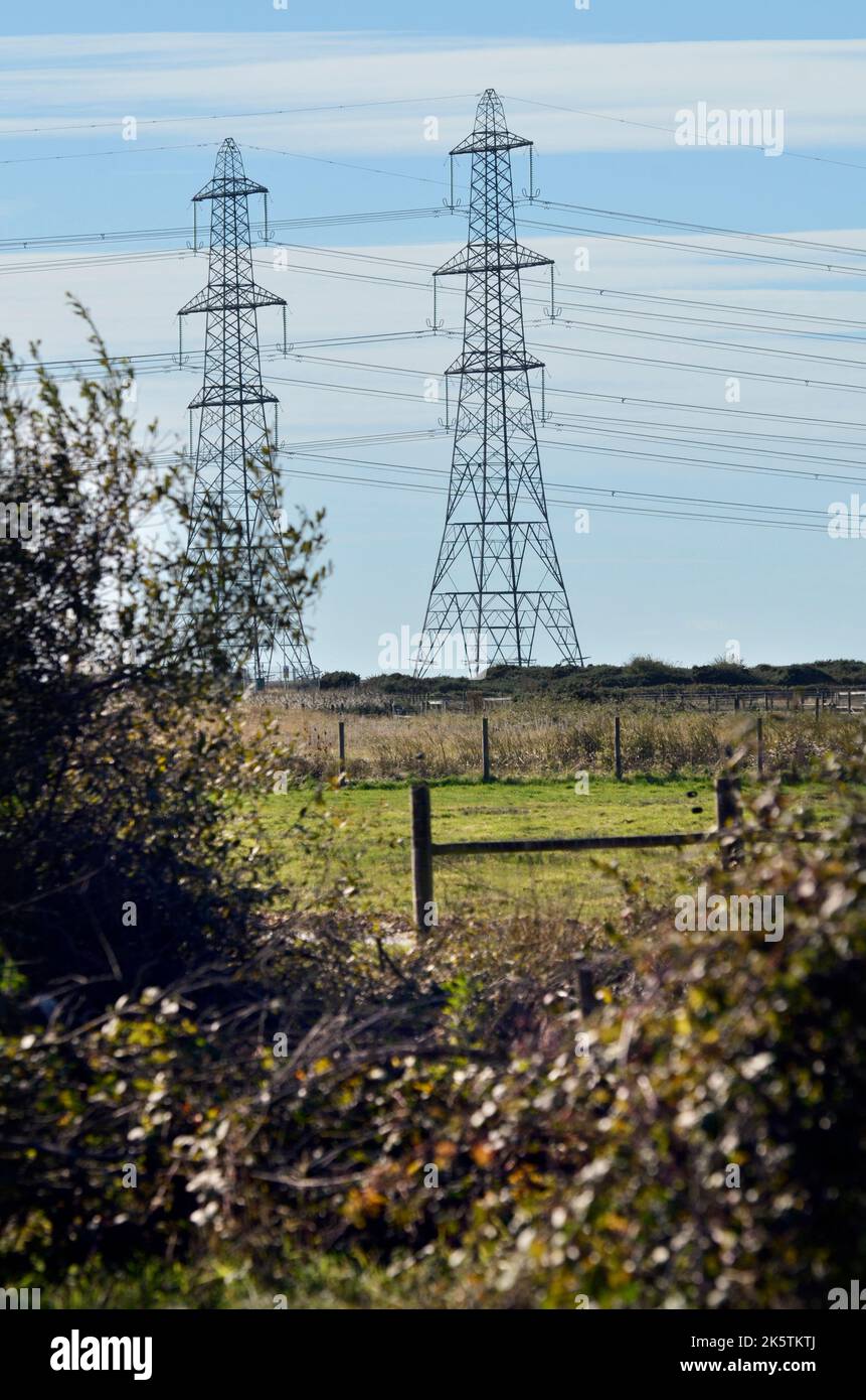 electricity distribution pylons dungeness kent england Stock Photo