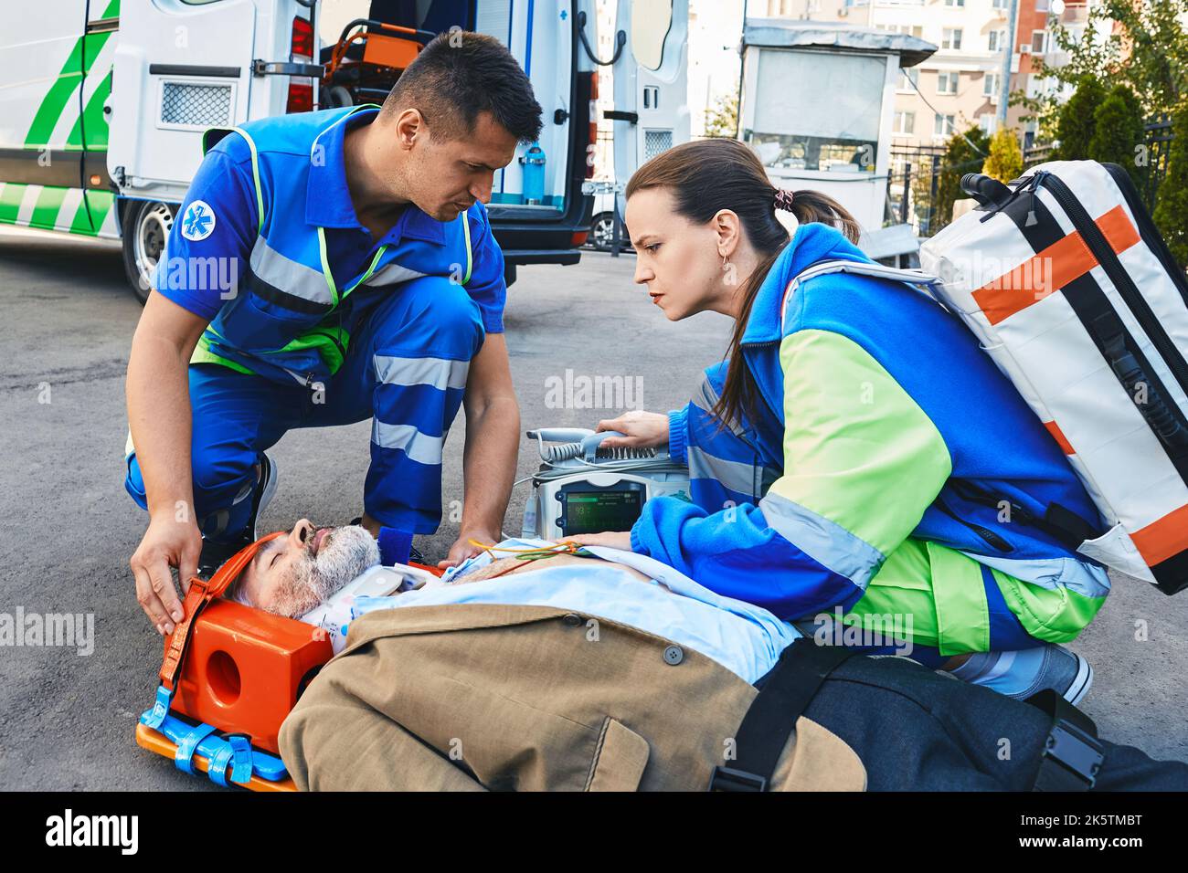 Paramedics immobilized senior patient with neck brace and spinal board