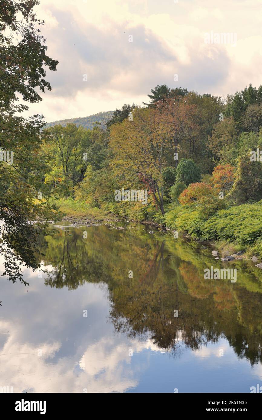 Lower Bartonsville, Vermont, USA. The Williams River slicing through the picturesque New England countryside while reflecting its surroundings. Stock Photo