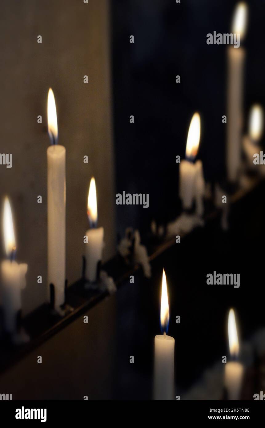 lit burning candles in church Stock Photo Alamy